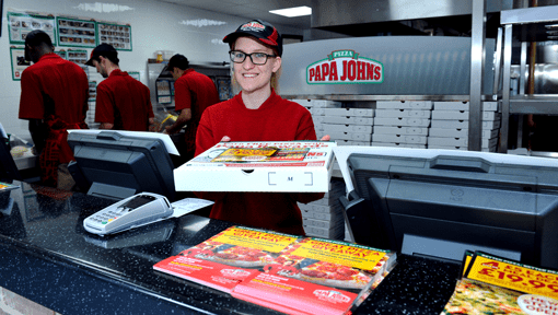 Papa John's employee holding pizza box