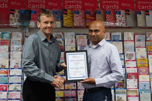 Card Connection's Hanish Patel receiving certificate of achievement