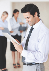 Man smiling at iPad