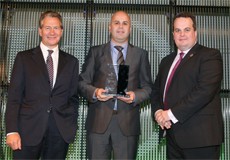Laurence Knott, Auditel's Head of Marketing and Michael Portillo, presenting the Award to Ciaran Sheehan of Care Circle Group.-1