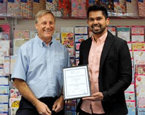 Bd B E F A C E A F Man holding certificate