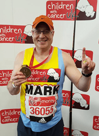 Man holding London Marathon medal