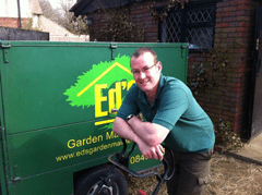 Man beside Ed's Garden Maintenance Truck