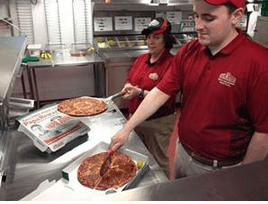 Pap John's Staff Making a Pizza