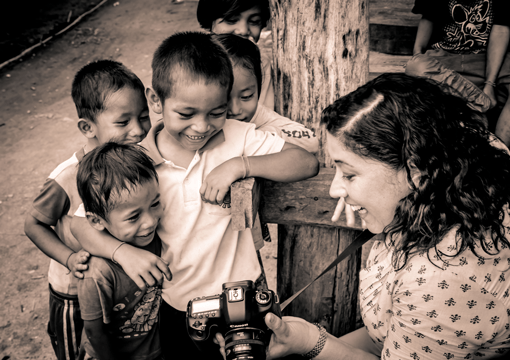 Rebecca Robyns with several children who have benefited from EYESeeMe.