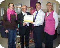 Laurence Bagley from Recognition Express presents Sim Shalom, Sales Director for Listawood with their Supplier of the Year Award 2009. From left to right: Becky Raisbury (Account Manager), Laurence Bagley (Recognition Express), Sim Shalom (Sales Director) and Mel Walker (Customer Service Manager). 