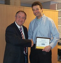 Ian Marshall being presented with his franchise owners plaque by Laurence Bagley, Finance Director for Recognition Express