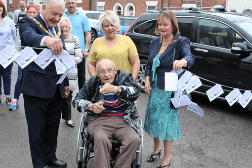 Jim Brazier cutting ribbon