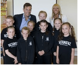 Duncan Bannatyne and Razzamataz owner Denise with students. 