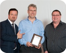 Pic 1 - Mark Phelps (centre); FASTSIGNS guest Ricky Gervais lookalike (left); and Dave Callister, franchise business consultant for FASTSIGNS.
